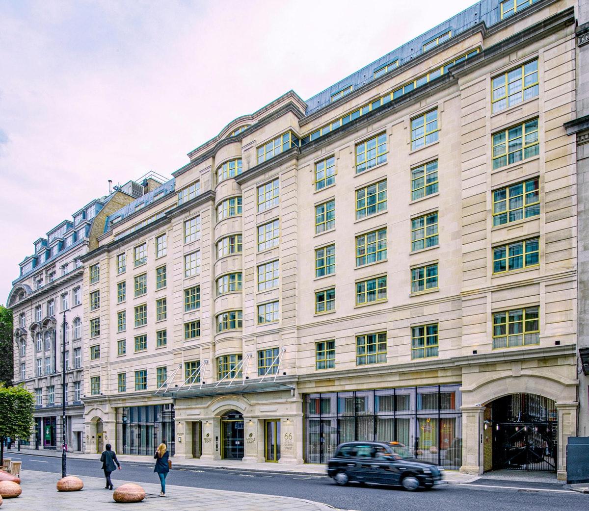 Middle Eight - Covent Garden - Preferred Hotels And Resorts Λονδίνο Εξωτερικό φωτογραφία The photo shows a large, multi-story building with a classical architectural style. The facade features a mix of light-colored stone and large windows, giving it a sophisticated appearance. The building has several levels with prominent horizontal li